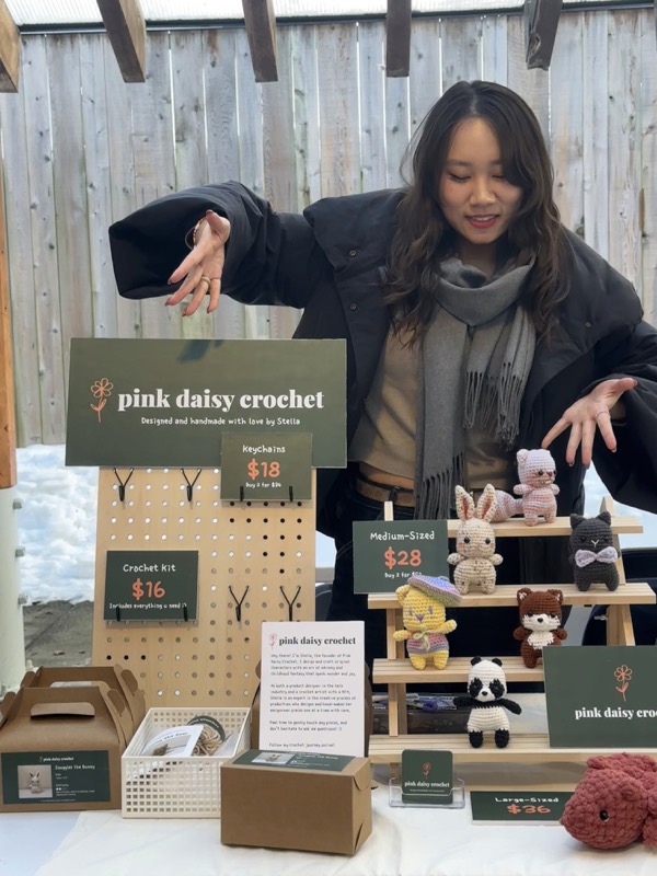 Stella at her Pink Daisy Crochet market stand