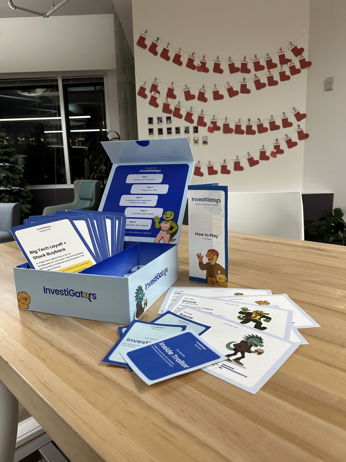 The finished InvestiGators game box, cards, and pamphlet on a table